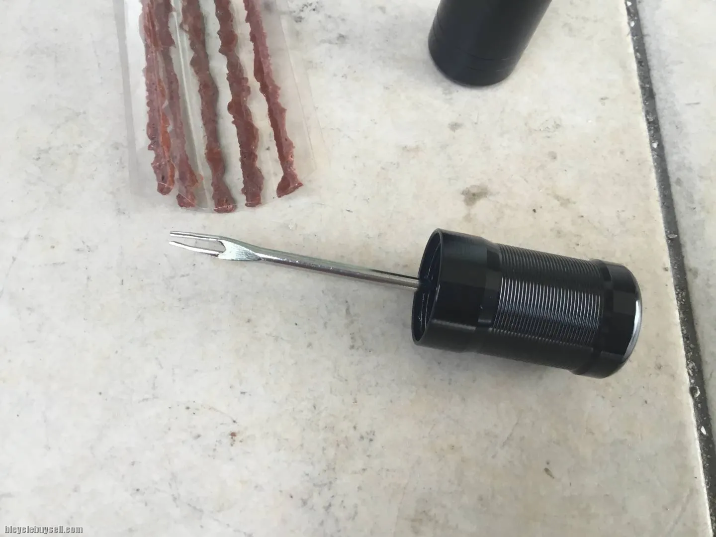 Tubeless/Tubular Cigar Tool Fixes Punctures in Style--  free courier
