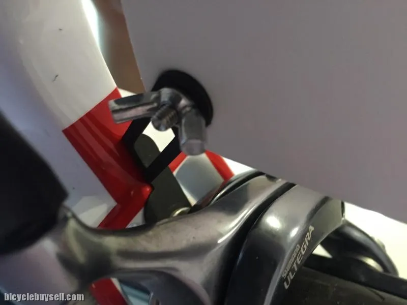 Race number holder clip for rear break caliper