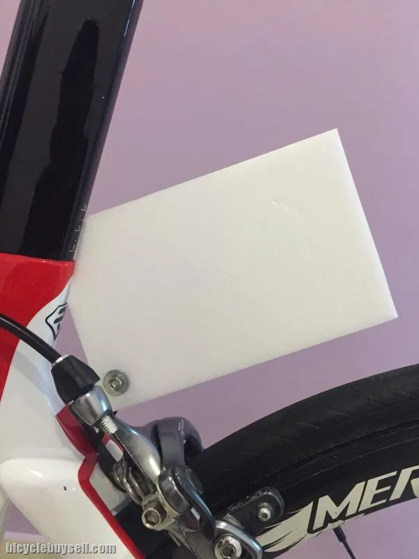 Race number holder clip for rear break caliper