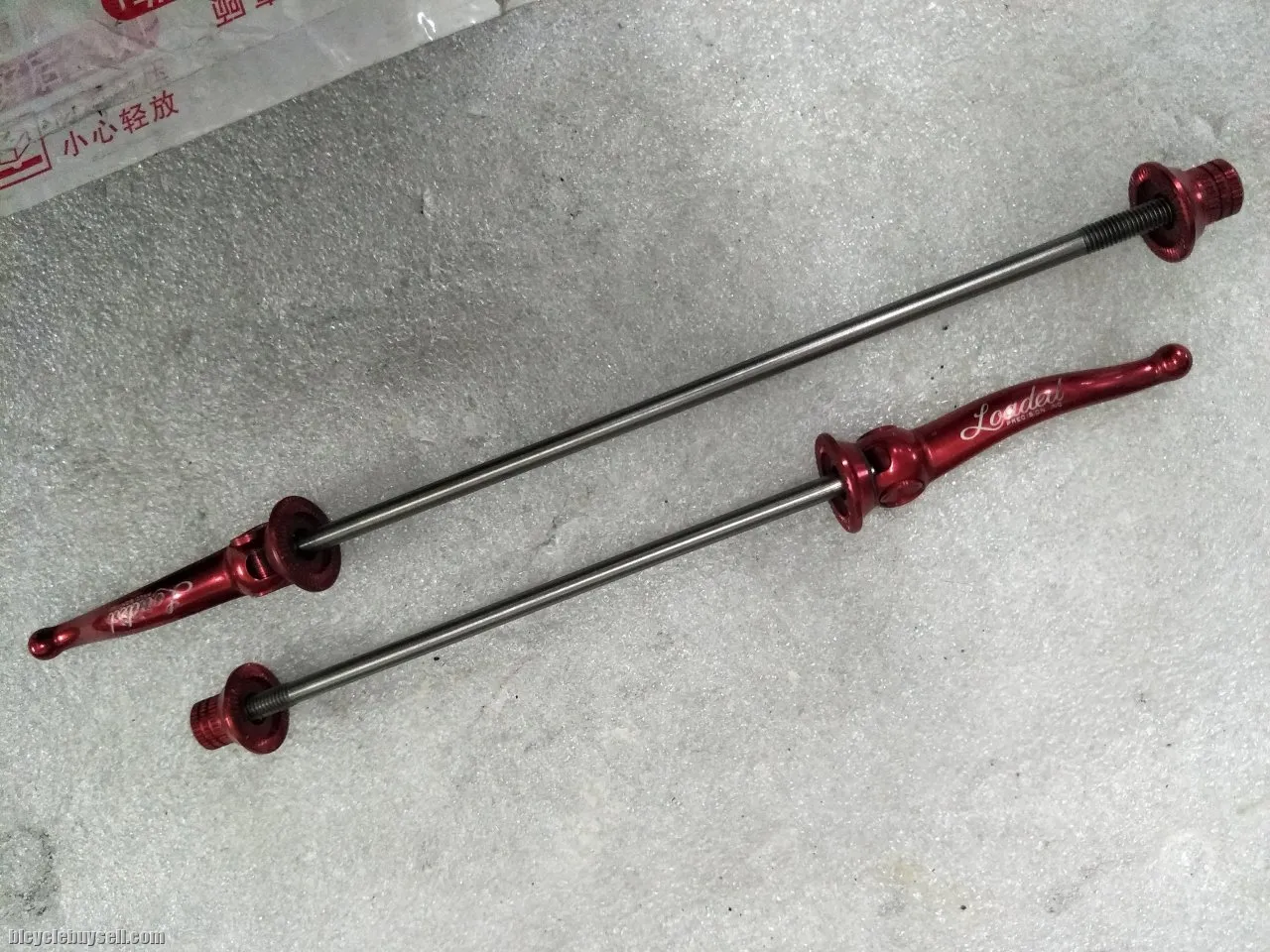 Loaded ultralite wheel titanium skewer pair - used less than a month - Pair weight only ~45grams