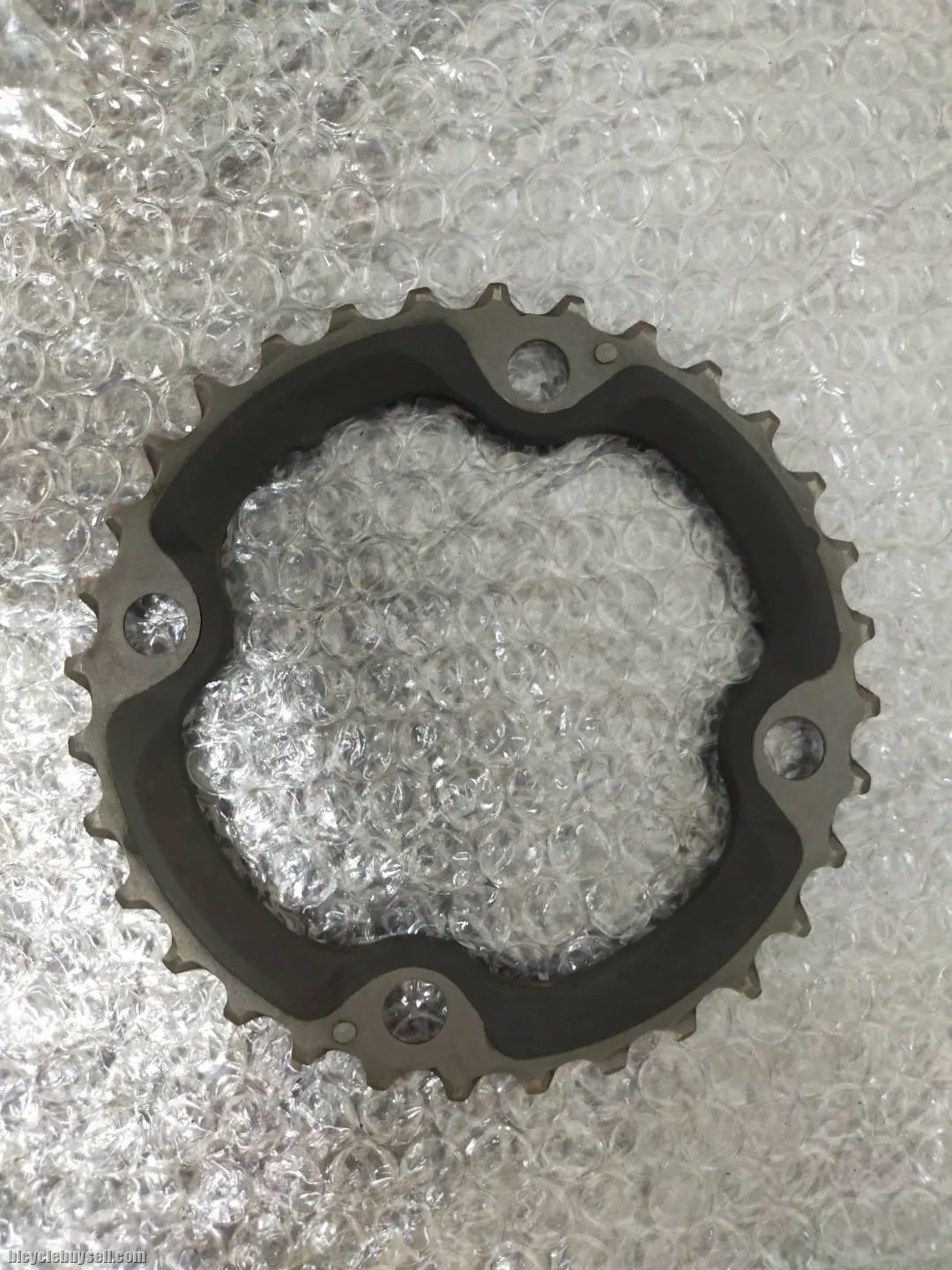 TAKEN OUT FROM XT CRANKSET 104BCD TITANIUM - NOT EVEN RIDEN, SELLING DUE TO CHANGE CHAINRING